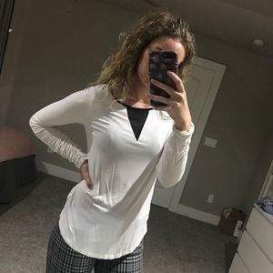 White long sleeve blouse with black details